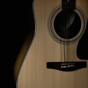 An image that showcases the intricate craftsmanship of the Alvarez AD60 Guitar, capturing the smooth curves of its solid spruce top, mahogany back and sides, and the exquisite mother-of-pearl inlays adorning its rosewood fingerboard