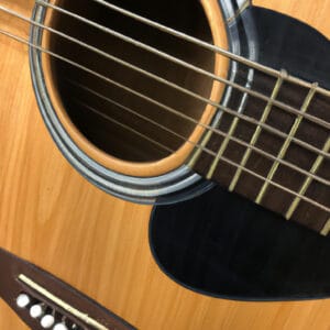 an enticing image of the Fender CD-60 Acoustic Guitar Bundle, showcasing its glossy sunburst finish and elegant rosewood fretboard