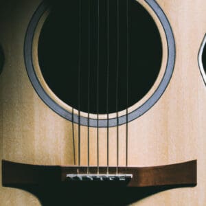 An image showcasing the exquisite Ibanez AW54OPN Artwood: a stunning acoustic guitar with a natural open pore finish