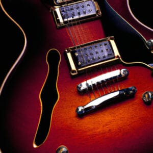 An image showcasing the exquisite craftsmanship of the Ibanez Performance Series PF12MHCEOPN: Capture the guitar's warm, rich tone with its mahogany body, the smoothness of its rosewood fretboard, and the elegant design of its cutaway shape