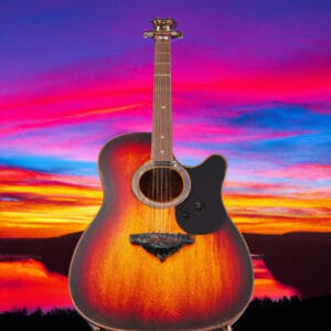 An image showcasing the exquisite Martin D-28 Modern Deluxe guitar against a backdrop of vibrant sunset hues, capturing its sleek, high-performance features - the carbon fiber bridge plate, Adirondack spruce top, and golden tuners