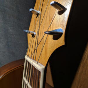 the essence of musical magic with an enchanting image of the Oscar Schmidt OD312 Natural guitar