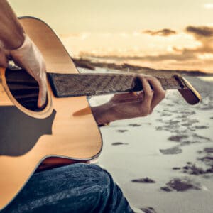 An image showcasing a Traveler Guitar Acoustic Guitar being played on a serene, white sandy beach at sunset