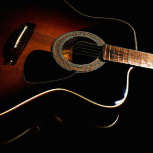 An image showcasing the exquisite Yamaha FG820 acoustic guitar in all its glory, capturing its sleek and slender dreadnought body, rich mahogany finish, and intricate abalone rosette, resonating with a warm, melodious aura