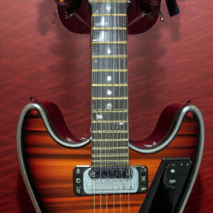 An image showcasing the exquisite Yamaha FG850 Guitar in all its glory: its glossy sunburst finish reflecting warm hues, the sleek mahogany body contrasting against the smooth rosewood fingerboard, and the gleaming chrome tuning pegs adding a touch of elegance