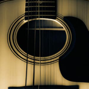 An image capturing the elegance of the Yamaha Storia III: a sleek, ebony acoustic guitar with a solid Sitka spruce top, capturing the essence of its rich, warm tones and intricate mother-of-pearl inlay