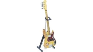 A colorful electric guitar on a black stand with adjustable hooks, ideal for musicians and collectors to showcase their instruments.