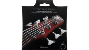 Close-up of electric bass guitar strings with tuning pegs and headstock, highlighting quality and craftsmanship.