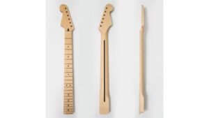 A close-up image of three unfinished guitar necks made of light wood, showcasing different shapes and designs for customization.