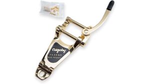 Staple remover with gold finish and ergonomic black handle, ideal for office and school use, easy to operate, and built for durability to quickly remove staples without damage.